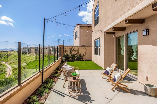 view of patio / terrace with fence