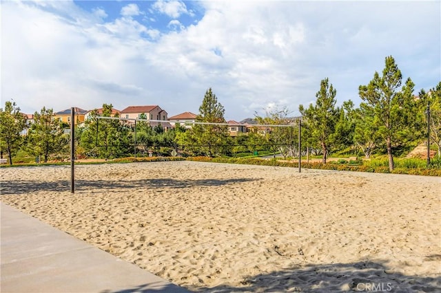 surrounding community featuring volleyball court and a residential view