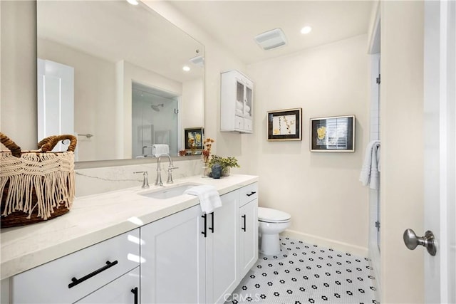 full bath with vanity, toilet, recessed lighting, and baseboards