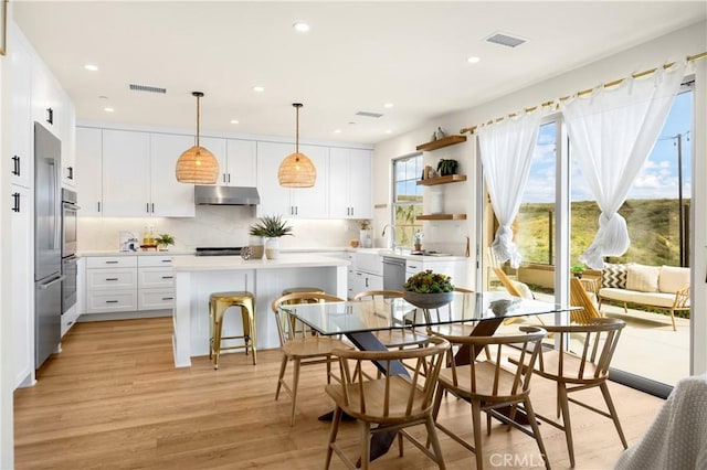 dining room featuring recessed lighting, visible vents, and light wood-style floors