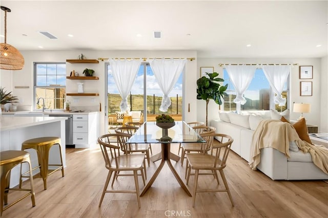 dining room featuring recessed lighting, light wood-style floors, and visible vents