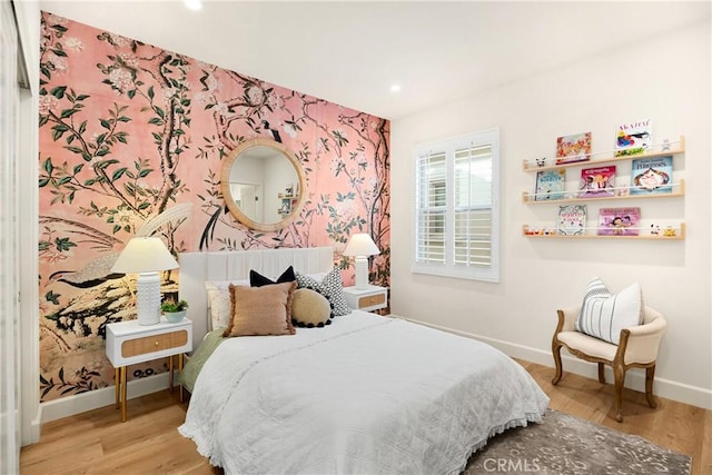 bedroom with wallpapered walls, recessed lighting, wood finished floors, and baseboards