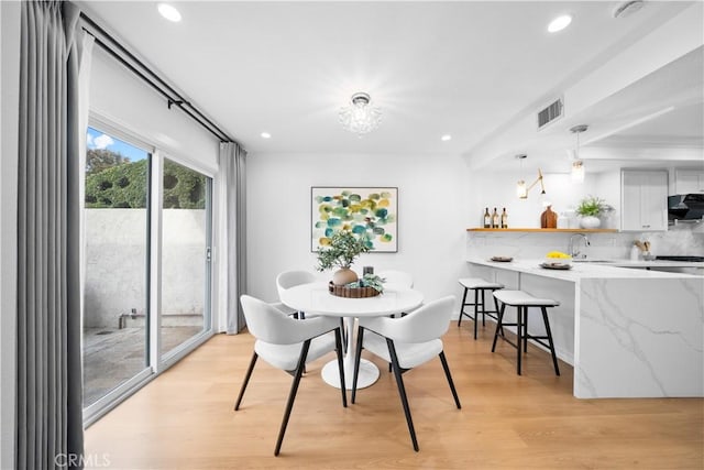 dining room with recessed lighting, visible vents, and light wood finished floors