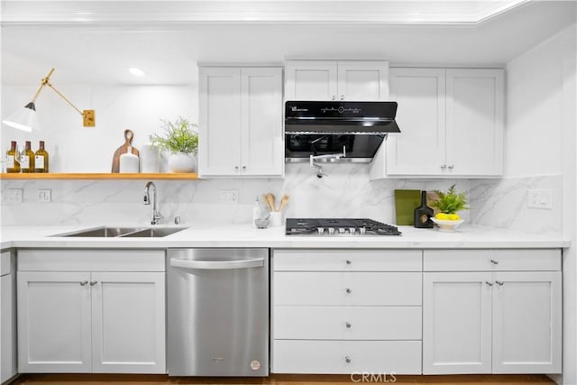 kitchen featuring ventilation hood, open shelves, a sink, white cabinets, and appliances with stainless steel finishes