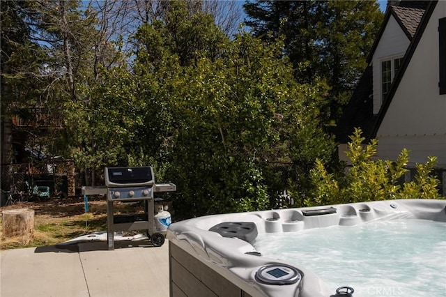 exterior space featuring a jacuzzi