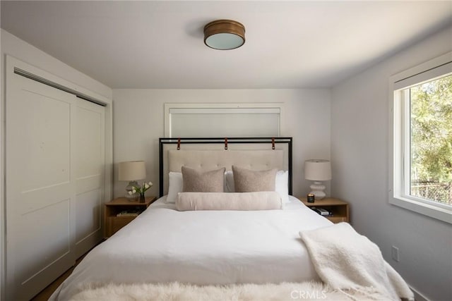bedroom featuring multiple windows
