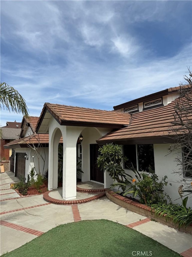 2440 Amelgado Dr, Hacienda Heights, CA 91745 - exterior space featuring stucco siding, a tiled roof, concrete driveway, and a garage