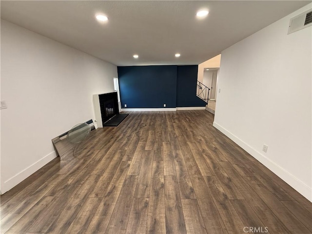 2440 Amelgado Dr, Hacienda Heights, CA 91745 - unfurnished living room with dark wood finished floors, visible vents, recessed lighting, and stairway