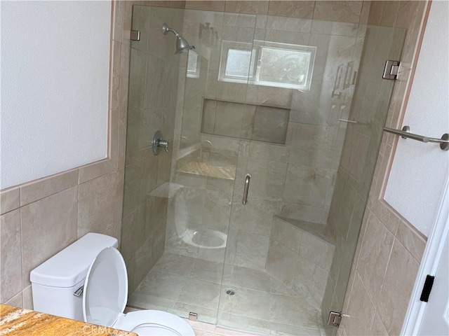 2440 Amelgado Dr, Hacienda Heights, CA 91745 - bathroom featuring a shower stall, toilet, and tile walls