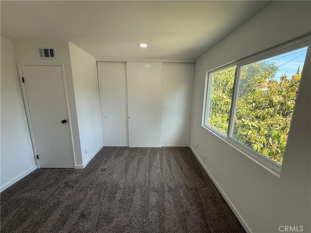 2440 Amelgado Dr, Hacienda Heights, CA 91745 - unfurnished bedroom with dark colored carpet, visible vents, a closet, and recessed lighting