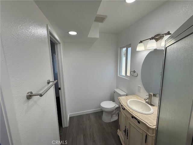 2440 Amelgado Dr, Hacienda Heights, CA 91745 - bathroom with visible vents, baseboards, toilet, wood finished floors, and vanity