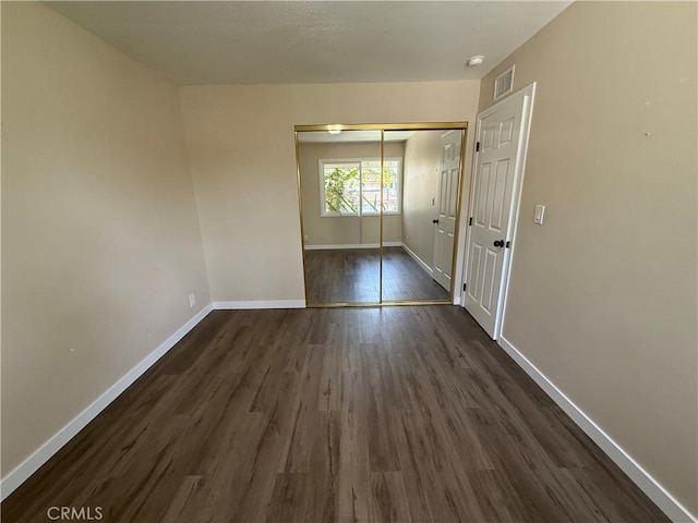 2440 Amelgado Dr, Hacienda Heights, CA 91745 - unfurnished bedroom with visible vents, baseboards, a closet, and dark wood-style flooring