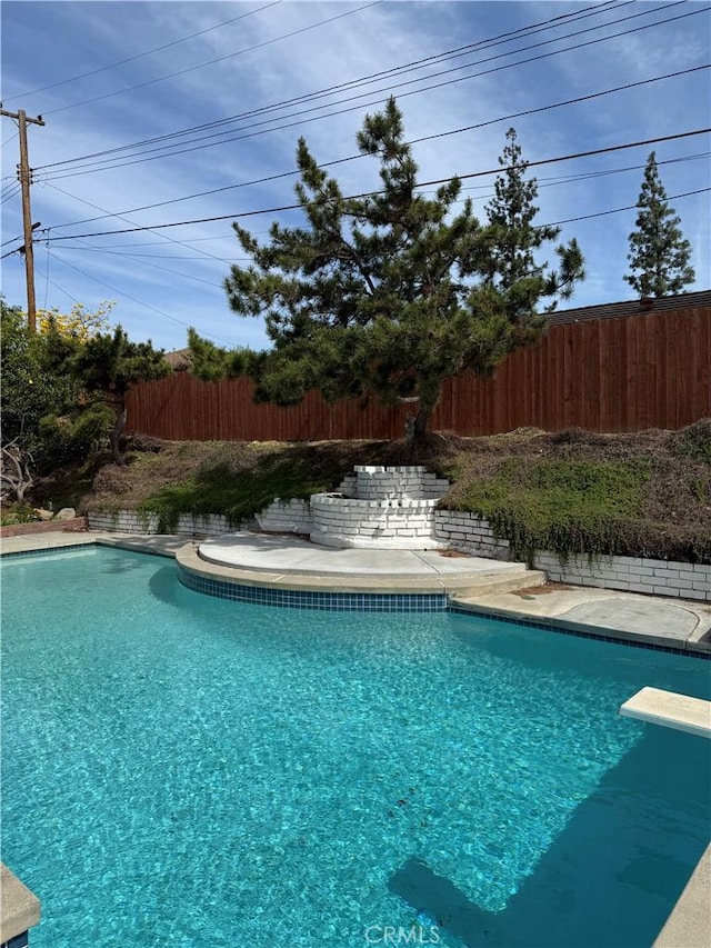 2440 Amelgado Dr, Hacienda Heights, CA 91745 - view of swimming pool with a fenced in pool, fence, and a diving board