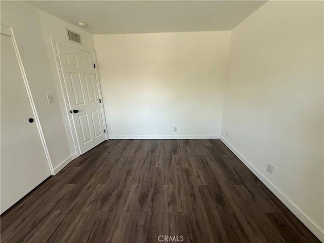 2440 Amelgado Dr, Hacienda Heights, CA 91745 - unfurnished room featuring visible vents, baseboards, and dark wood-style flooring