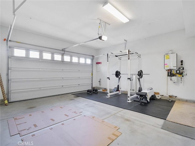 garage featuring water heater and a garage door opener