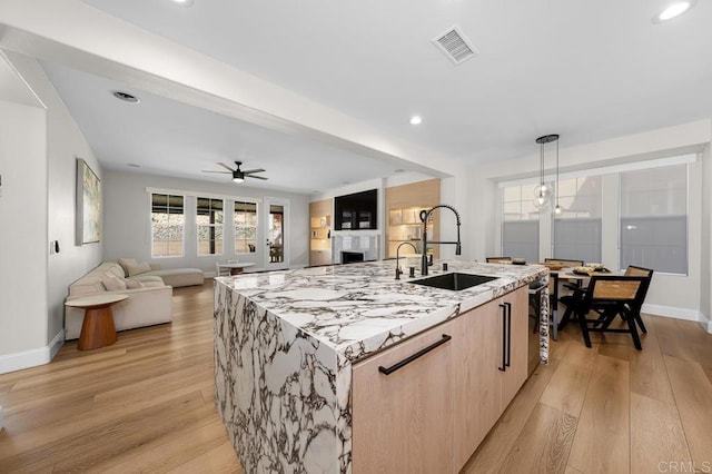1452 Canoe Creek Way, Chula Vista, CA 91915 - kitchen featuring light wood-style floors, visible vents, light brown cabinets, and a sink