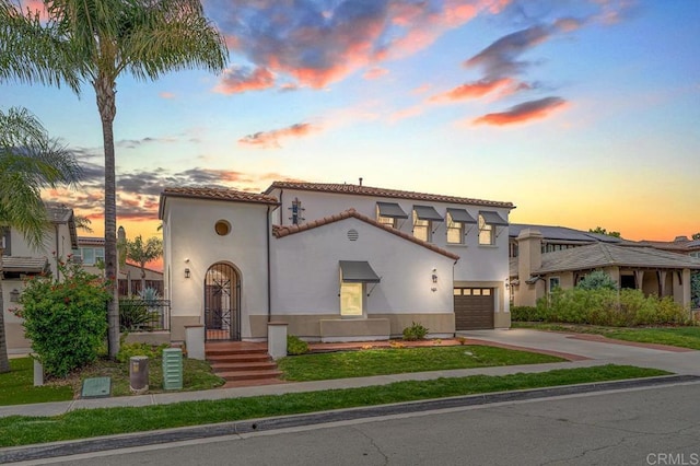 1452 Canoe Creek Way, Chula Vista, CA 91915 - mediterranean / spanish home featuring stucco siding, an attached garage, driveway, and a tiled roof