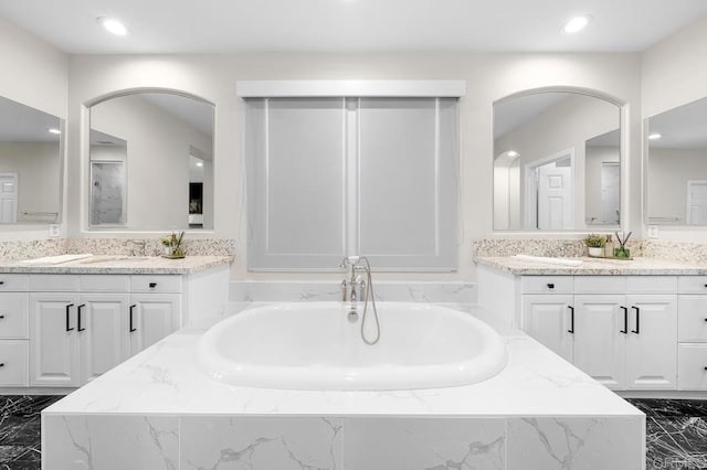 1452 Canoe Creek Way, Chula Vista, CA 91915 - full bathroom with a bath, marble finish floor, a sink, and two vanities