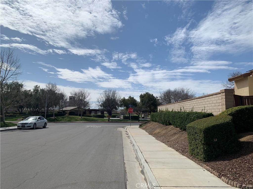 1561 Palma Bonita, Perris, CA 92571 - view of road featuring traffic signs, curbs, and sidewalks