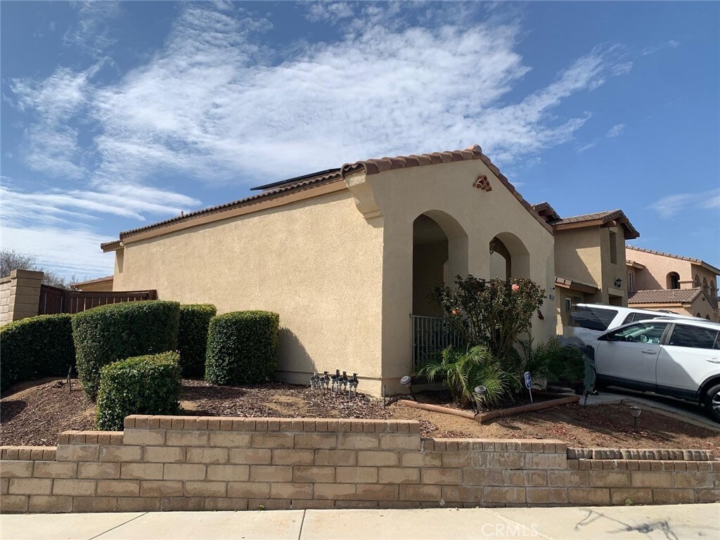 1561 Palma Bonita, Perris, CA 92571 - view of home's exterior with stucco siding and a tile roof