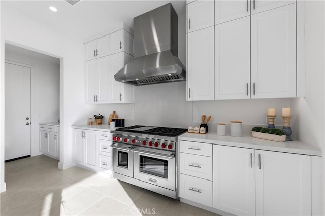 118 Sunnybank Blvd, Irvine, CA 92618 - kitchen featuring wall chimney exhaust hood, light countertops, white cabinetry, and range with two ovens