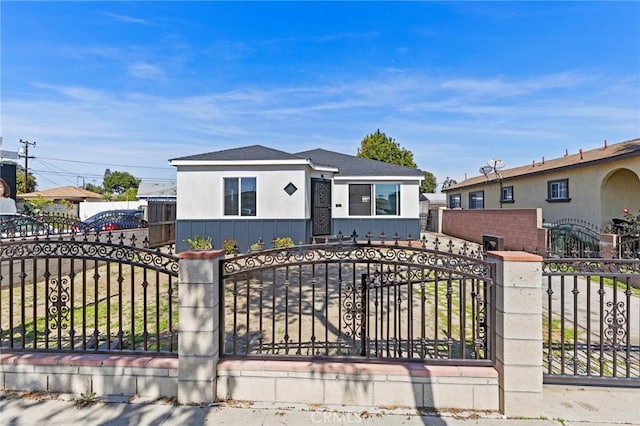 view of front of home featuring fence, a gate, and board and batten siding