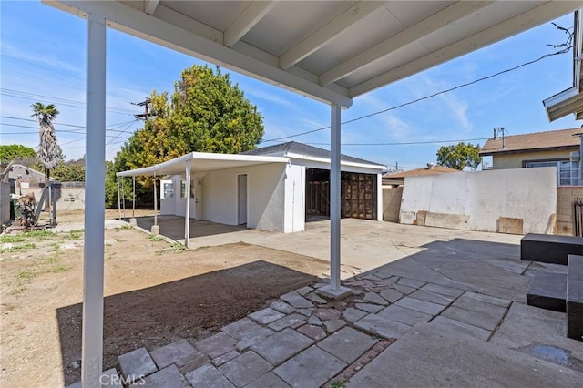 view of patio / terrace featuring fence