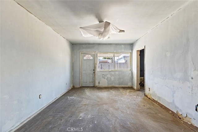 spare room featuring concrete flooring