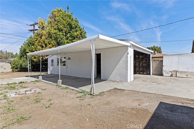 exterior space with a carport