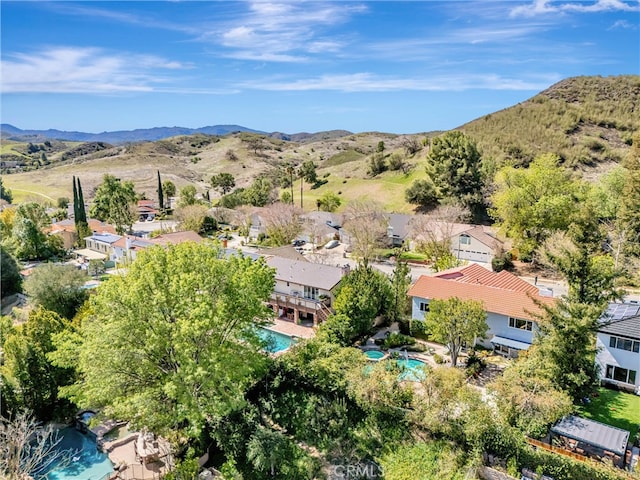 27072 Esward Dr, Calabasas, CA 91301 - view of property location featuring a pool, a mountainous background, and nearby suburban area