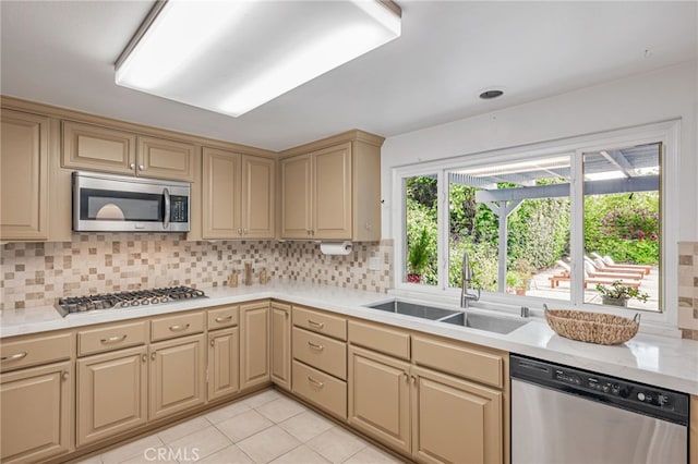 27072 Esward Dr, Calabasas, CA 91301 - kitchen featuring appliances with stainless steel finishes, a sink, backsplash, and light tile patterned flooring