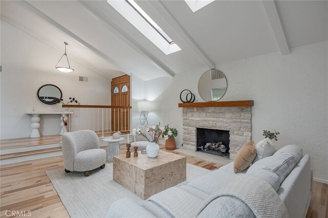 27072 Esward Dr, Calabasas, CA 91301 - living room featuring a skylight, wood finished floors, and a fireplace