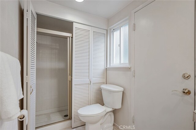 27072 Esward Dr, Calabasas, CA 91301 - full bath featuring a shower stall, a closet, toilet, and baseboards