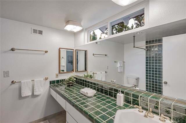 27072 Esward Dr, Calabasas, CA 91301 - full bath with a sink, tile patterned floors, a tile shower, and toilet