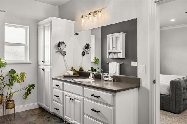 bathroom featuring baseboards, crown molding, recessed lighting, and vanity