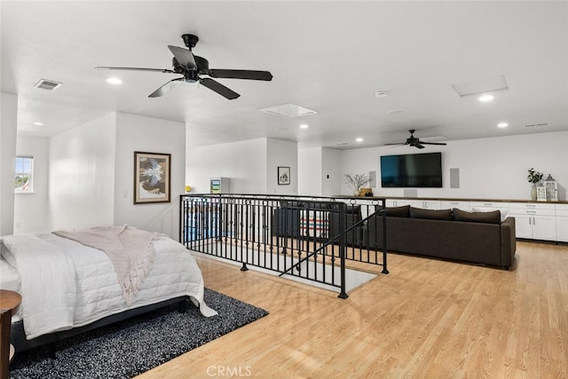 bedroom with visible vents, light wood-style flooring, and recessed lighting
