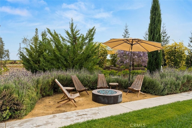 view of patio / terrace featuring a fire pit
