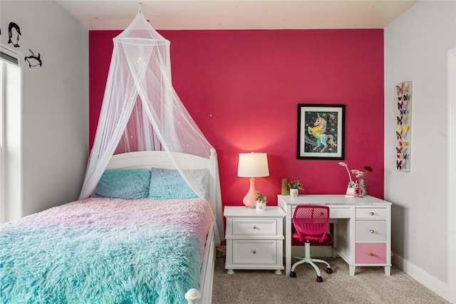 bedroom featuring baseboards and carpet flooring