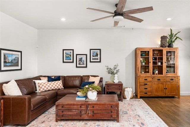 living area featuring wood finished floors, ceiling fan, and recessed lighting