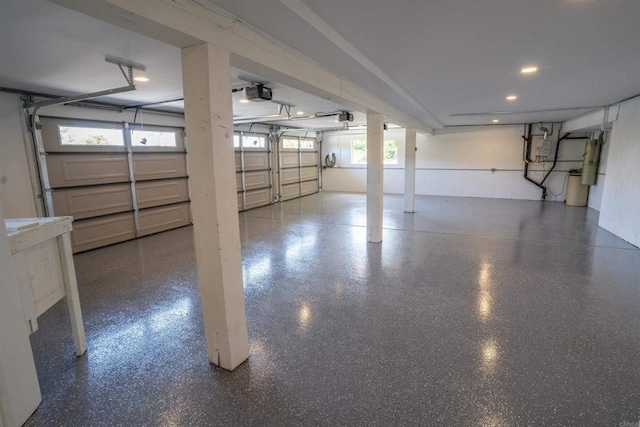 garage featuring recessed lighting and a garage door opener
