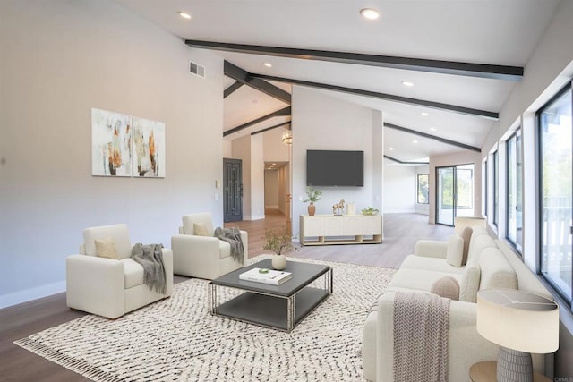 living area with recessed lighting, wood finished floors, visible vents, beamed ceiling, and baseboards