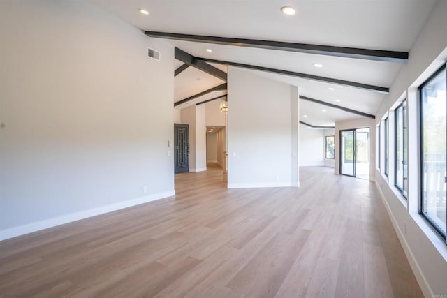 spare room with baseboards, visible vents, beamed ceiling, and recessed lighting