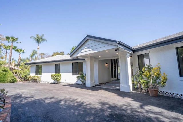 ranch-style house with stucco siding
