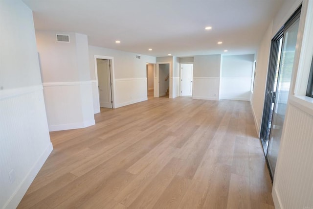 spare room featuring recessed lighting, light wood-type flooring, and visible vents