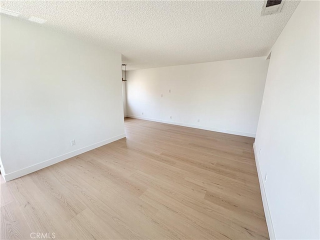 18131 Camino Bello Unit 4, Rowland Heights, CA 91748 - empty room featuring light wood-style floors and a textured ceiling