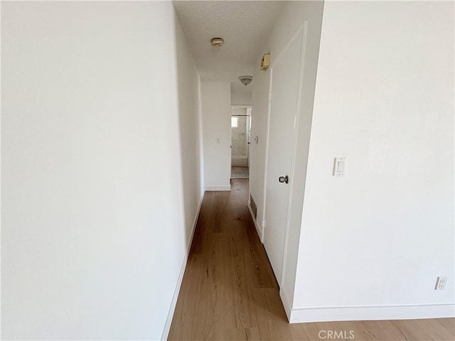 18131 Camino Bello Unit 4, Rowland Heights, CA 91748 - corridor featuring light wood-type flooring and baseboards