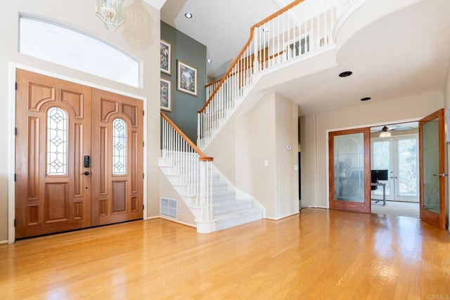 15881 Broad Oaks Rd, El Cajon, CA 92021 - entryway featuring a high ceiling, wood finished floors, stairs, a ceiling fan, and baseboards