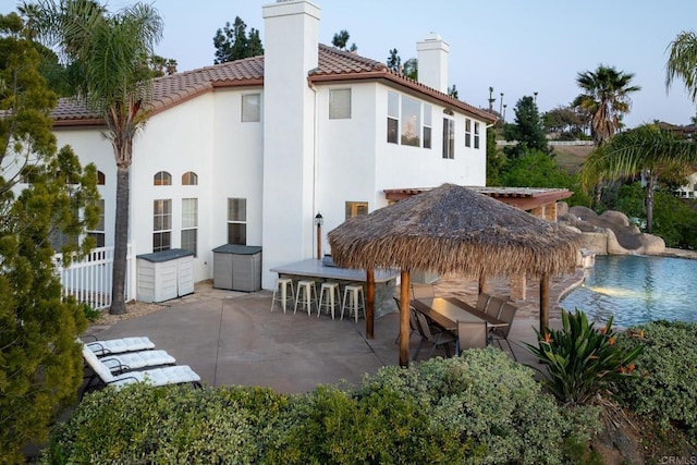 15881 Broad Oaks Rd, El Cajon, CA 92021 - rear view of house featuring a chimney, a patio, a tile roof, and stucco siding