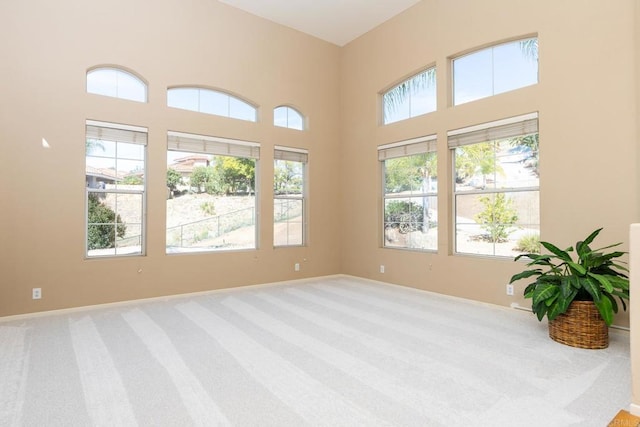 15881 Broad Oaks Rd, El Cajon, CA 92021 - carpeted spare room with baseboards and a high ceiling