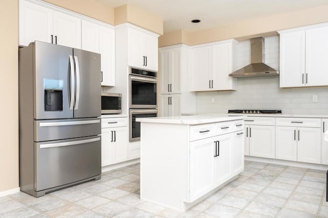 15881 Broad Oaks Rd, El Cajon, CA 92021 - kitchen with appliances with stainless steel finishes, wall chimney exhaust hood, light countertops, and white cabinetry